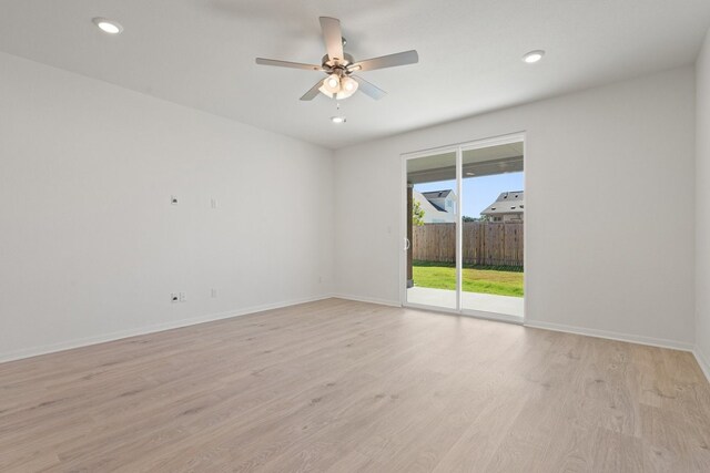 spare room featuring ceiling fan and light wood-type flooring