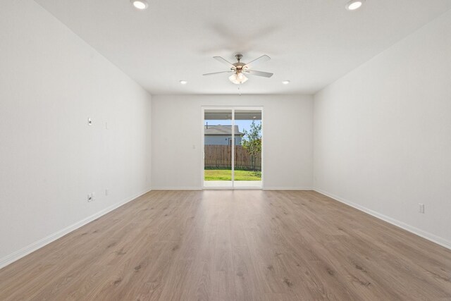 unfurnished room with light hardwood / wood-style flooring and ceiling fan