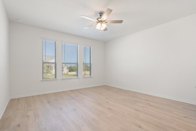 unfurnished room featuring light wood-type flooring and ceiling fan