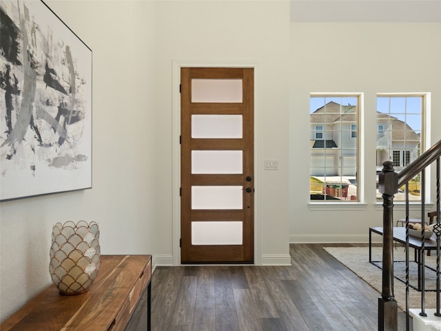 entryway with dark hardwood / wood-style floors