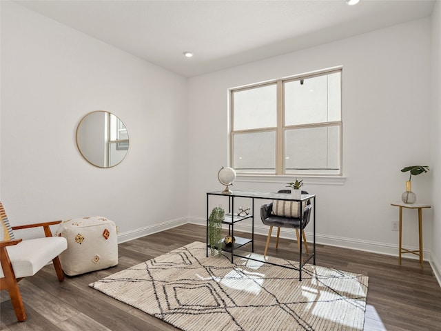 office space with dark wood-type flooring