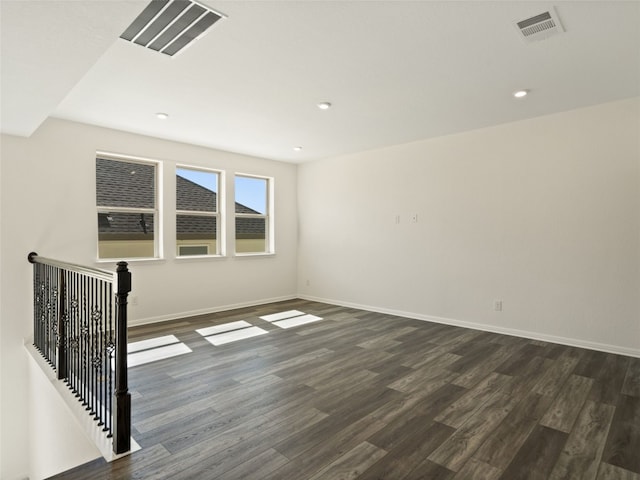 unfurnished room featuring hardwood / wood-style flooring