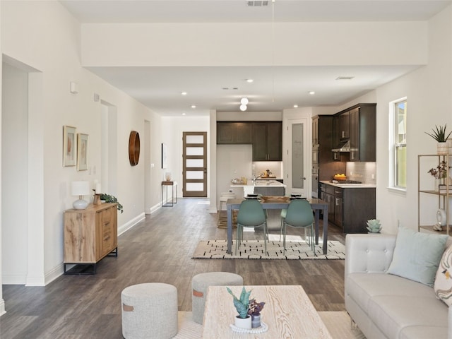 living room with dark hardwood / wood-style floors