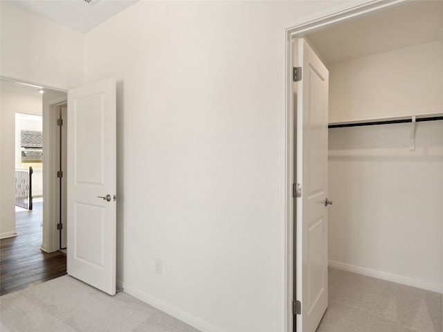 unfurnished bedroom featuring carpet and a closet