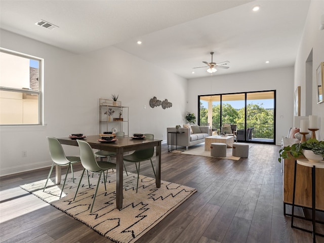 dining room featuring ceiling fan and dark wood-type flooring