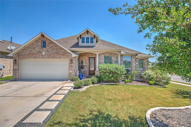 view of front of property with a front lawn and a garage