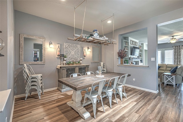 dining room featuring ceiling fan and wood-type flooring