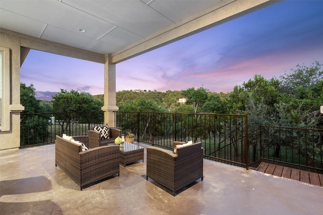 patio terrace at dusk with an outdoor living space