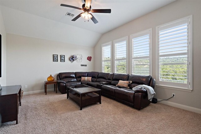 carpeted living room featuring ceiling fan, a wealth of natural light, and vaulted ceiling