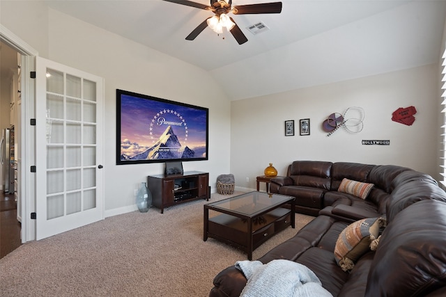 living room featuring ceiling fan, lofted ceiling, and carpet