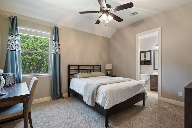 1104 Lions Lair, Leander, TX 78641 - bedroom featuring light colored carpet, ensuite bathroom, and a ceiling fan