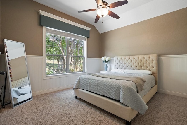 1104 Lions Lair, Leander, TX 78641 - carpeted bedroom featuring a wainscoted wall, vaulted ceiling, and a ceiling fan