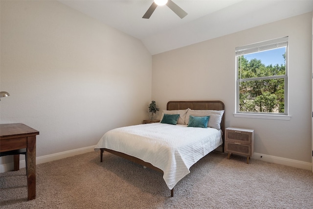 bedroom with ceiling fan, carpet flooring, and vaulted ceiling