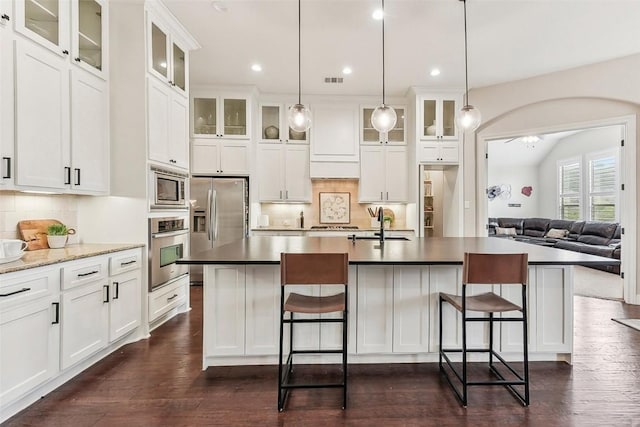 1104 Lions Lair, Leander, TX 78641 - kitchen with stainless steel appliances, decorative backsplash, dark wood finished floors, and recessed lighting