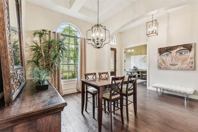 1104 Lions Lair, Leander, TX 78641 - dining room with a chandelier, dark wood-style flooring, beamed ceiling, coffered ceiling, and arched walkways