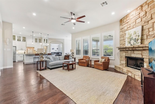 1104 Lions Lair, Leander, TX 78641 - living area featuring a fireplace, ceiling fan, dark wood-type flooring, and recessed lighting