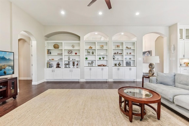 1104 Lions Lair, Leander, TX 78641 - living room with ceiling fan, dark wood finished floors, recessed lighting, and arched walkways