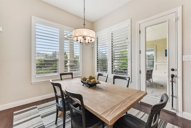 1104 Lions Lair, Leander, TX 78641 - dining room featuring a chandelier and dark wood-style floors