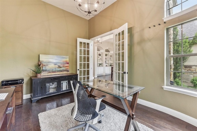 1104 Lions Lair, Leander, TX 78641 - home office featuring french doors, plenty of natural light, a chandelier, a towering ceiling, and wood-type flooring