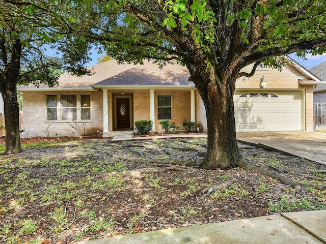 905 E Olympic Dr, Pflugerville, TX 78660 - single story home featuring an attached garage, driveway, brick siding, and roof with shingles