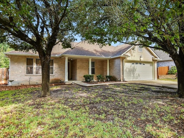 ranch-style home featuring a garage, brick siding, a shingled roof, fence, and concrete driveway