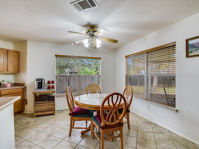 905 E Olympic Dr, Pflugerville, TX 78660 - dining space featuring healthy amount of natural light, light tile patterned floors, and ceiling fan