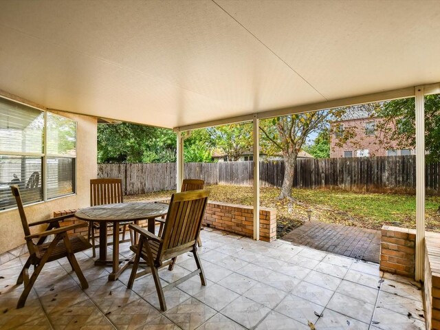 905 E Olympic Dr, Pflugerville, TX 78660 - fenced backyard with a patio and outdoor dining area