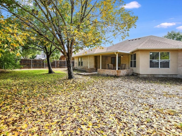 905 E Olympic Dr, Pflugerville, TX 78660 - back of house featuring a shingled roof and stucco siding