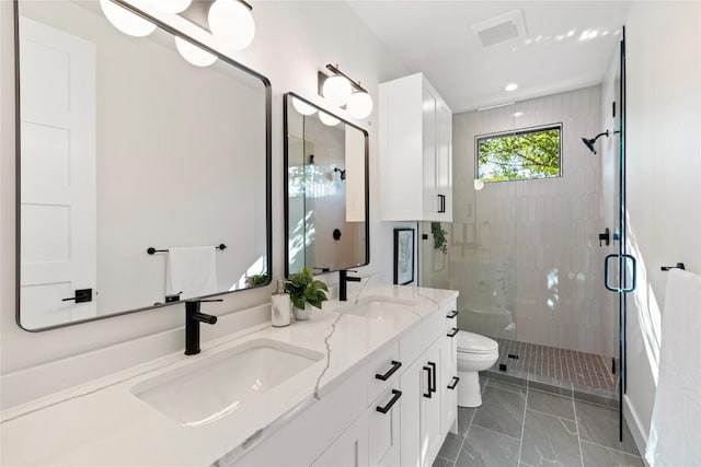 2109 Wordsworth Dr Unit 1, Austin, TX 78704 - full bath with a shower stall, double vanity, and marble look tiles