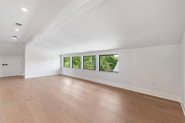 2109 Wordsworth Dr Unit 1, Austin, TX 78704 - spare room featuring lofted ceiling, light wood finished floors, and recessed lighting