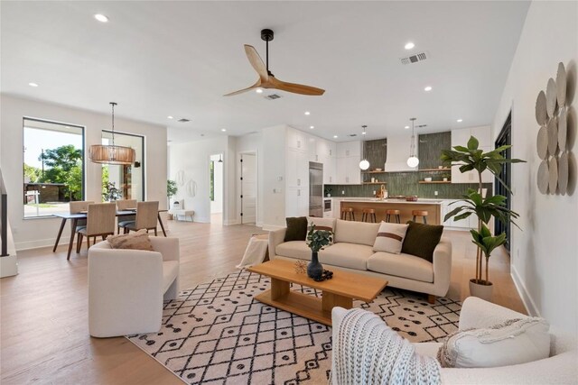 2109 Wordsworth Dr Unit 1, Austin, TX 78704 - living area featuring a ceiling fan, light wood finished floors, and recessed lighting