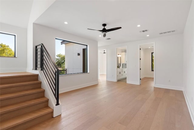 2109 Wordsworth Dr Unit 1, Austin, TX 78704 - spare room with stairs, light wood-style flooring, recessed lighting, a ceiling fan, and baseboards