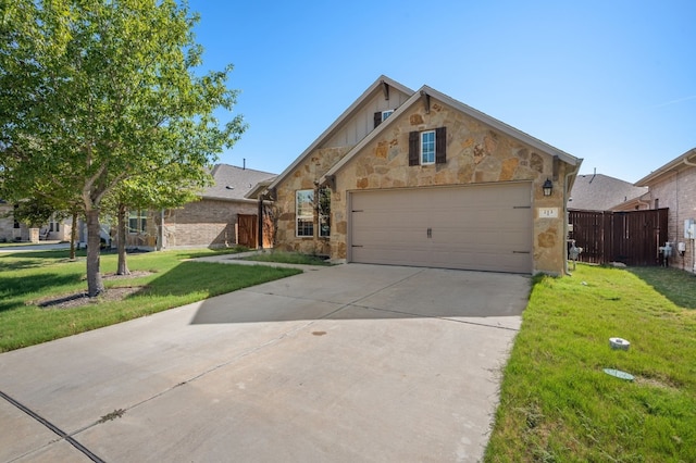 view of front of home with a garage and a front lawn