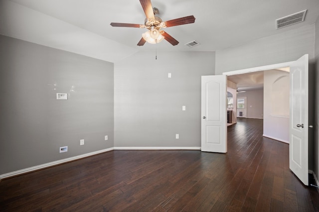 empty room with ceiling fan, hardwood / wood-style floors, and vaulted ceiling