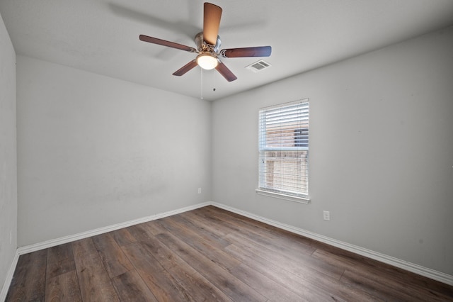 unfurnished room with ceiling fan and hardwood / wood-style flooring