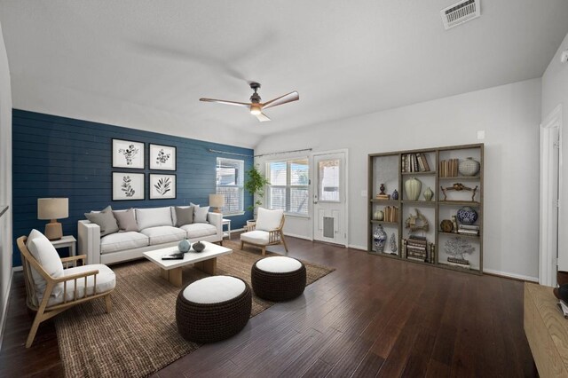 living room featuring ceiling fan and wood-type flooring