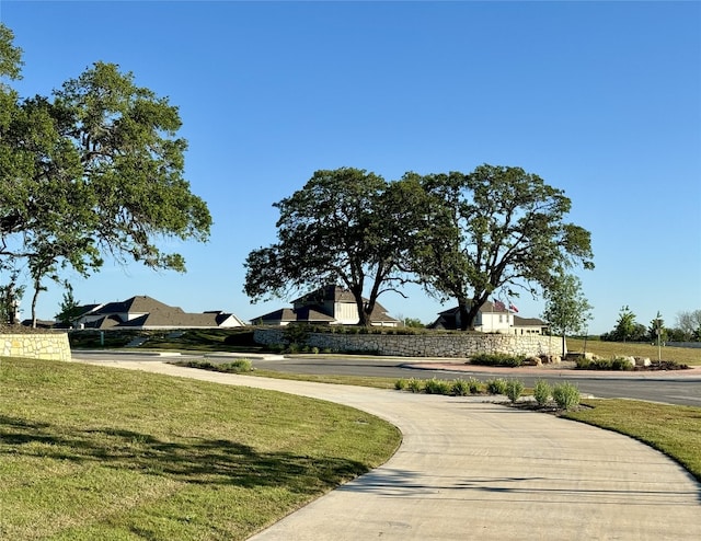 view of community featuring a lawn