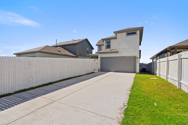 exterior space featuring a yard and a garage