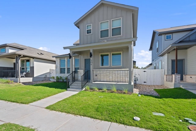 view of front of home with covered porch and a front yard