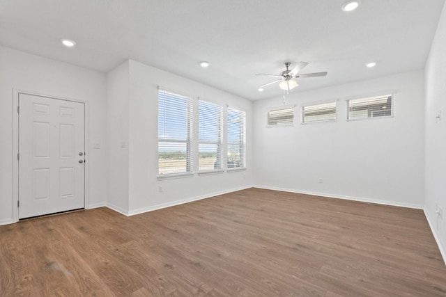 interior space featuring wood-type flooring and ceiling fan