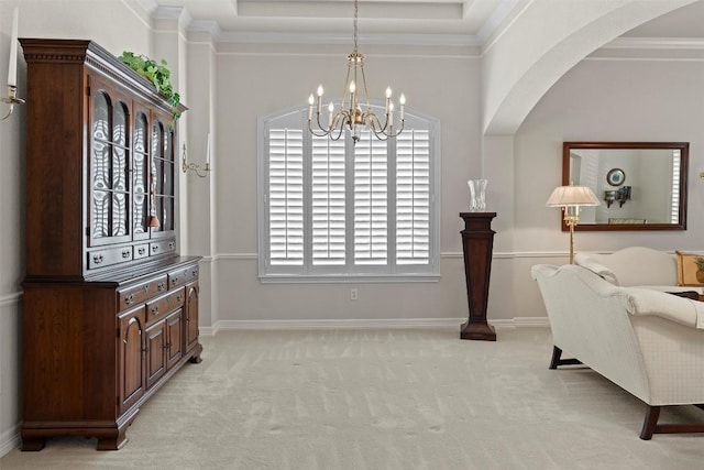 sitting room featuring a notable chandelier, baseboards, crown molding, and light colored carpet