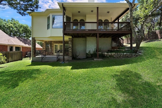 rear view of property with french doors, a yard, a chimney, central air condition unit, and fence