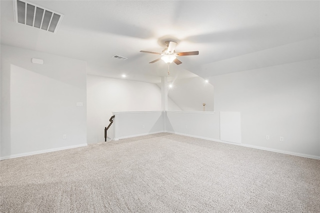 unfurnished room featuring ceiling fan and carpet