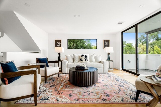 living room with light hardwood / wood-style flooring