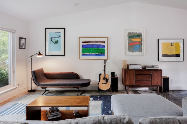 living room featuring lofted ceiling