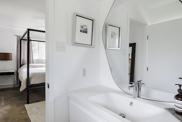 bathroom featuring concrete flooring and sink