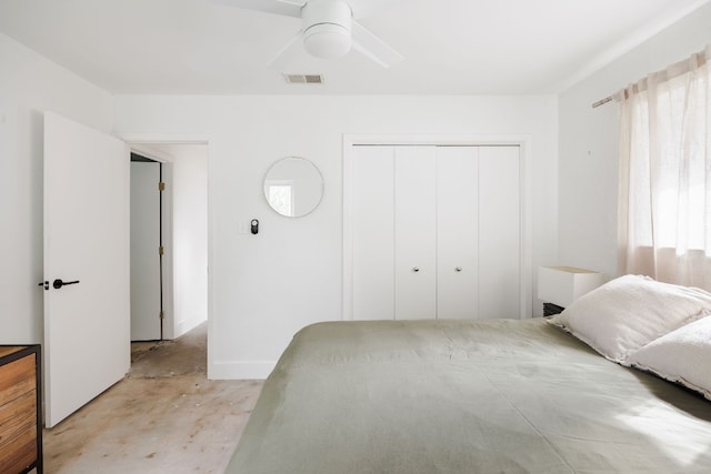 bedroom with ceiling fan and a closet