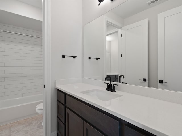 full bathroom with shower / bath combination, tile patterned floors, toilet, and vanity