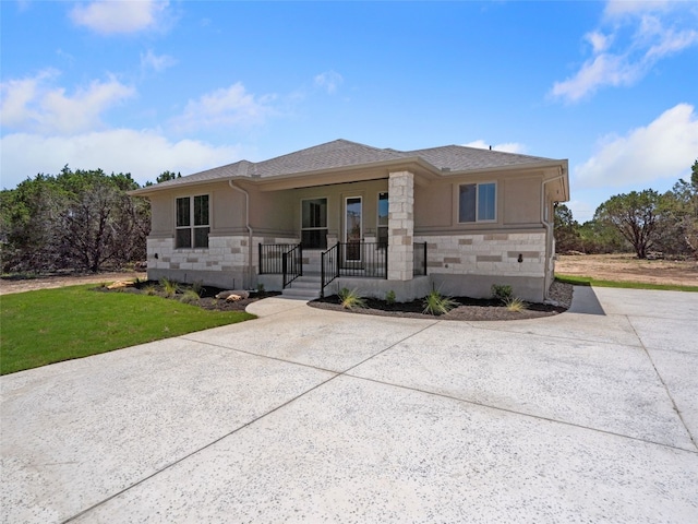 view of front of house featuring a front yard and covered porch