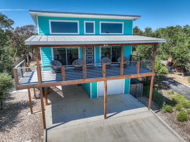 view of front of house featuring a wooden deck and a garage